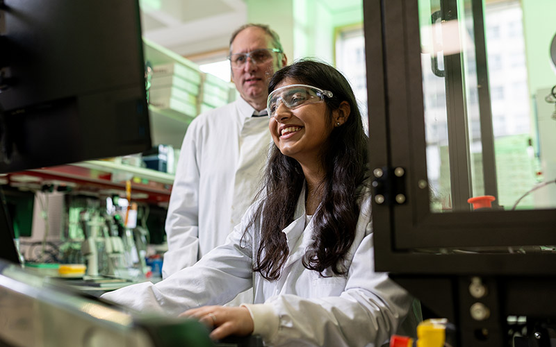 Researchers working at a computer