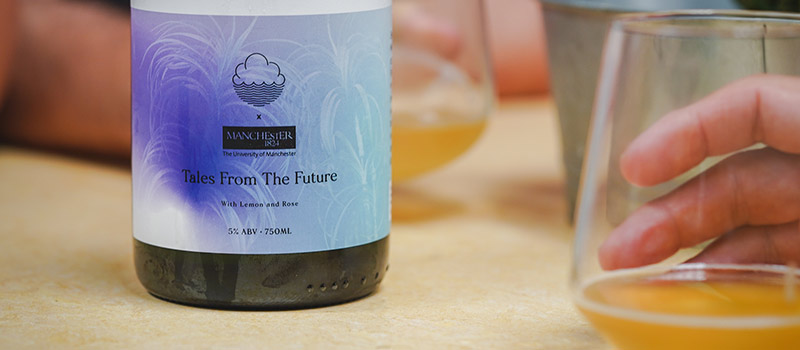 Bottle of "Tales from the future", lemon and rose, 5% abv, and a glass containing some of the drink 